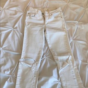 White garage jeans. Ripped.